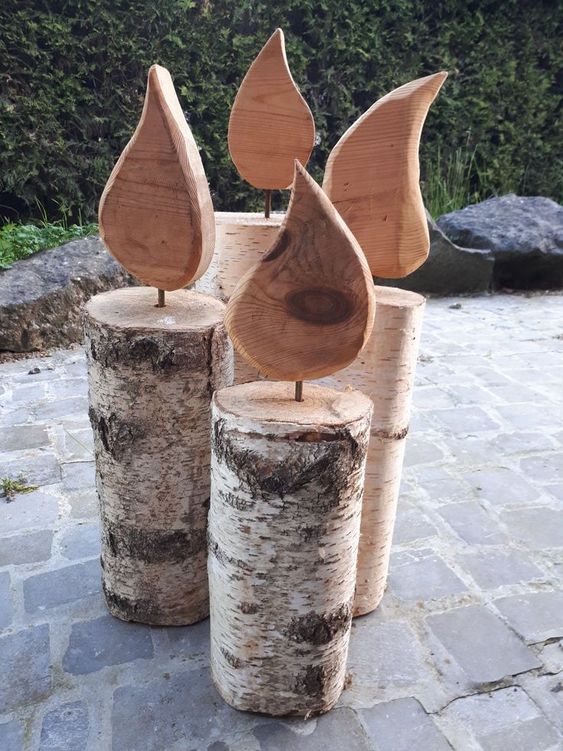 velas decorativas hechas con troncos de madera